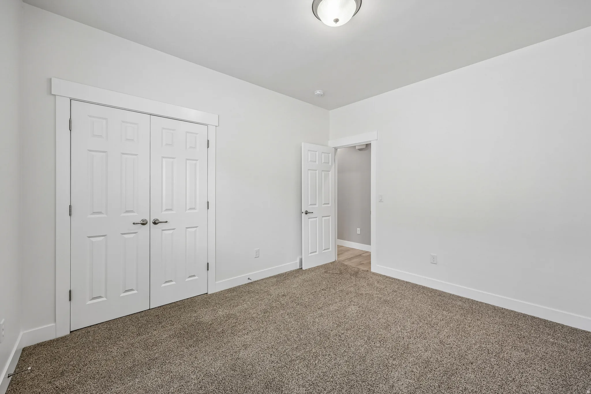 Neutral wall paint with contrasting white baseboards
