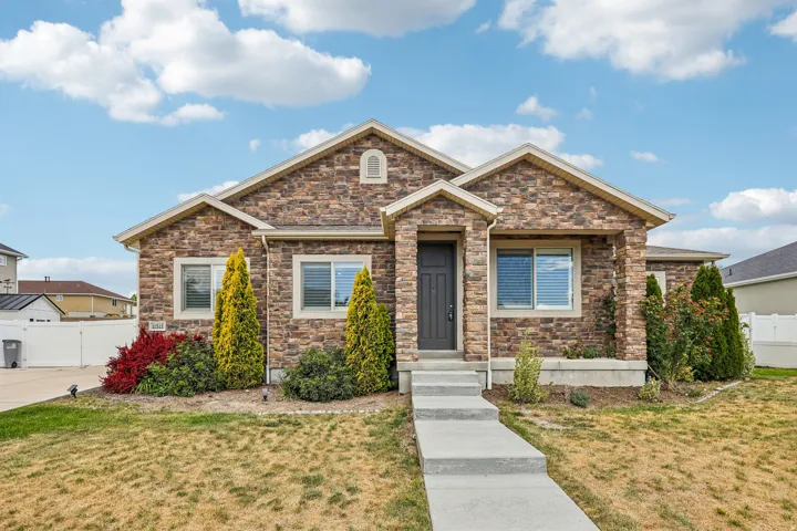 Stone veneer facade with gabled rooflines