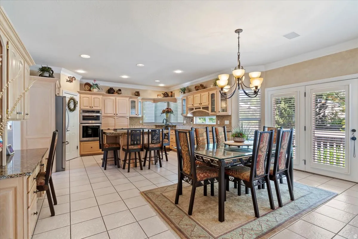 Spacious kitchen and dining area with tile flooring and a built-in desk