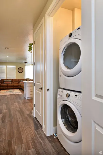 Dedicated laundry area featuring a stacked washer and dryer