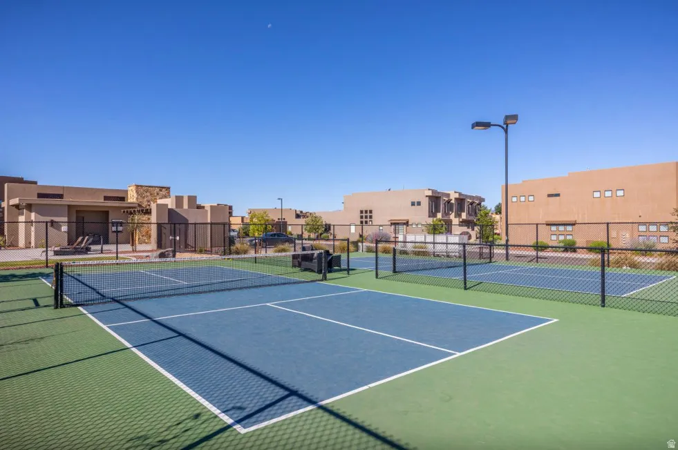 Hard-surfaced pickleball courts with perimeter fencing