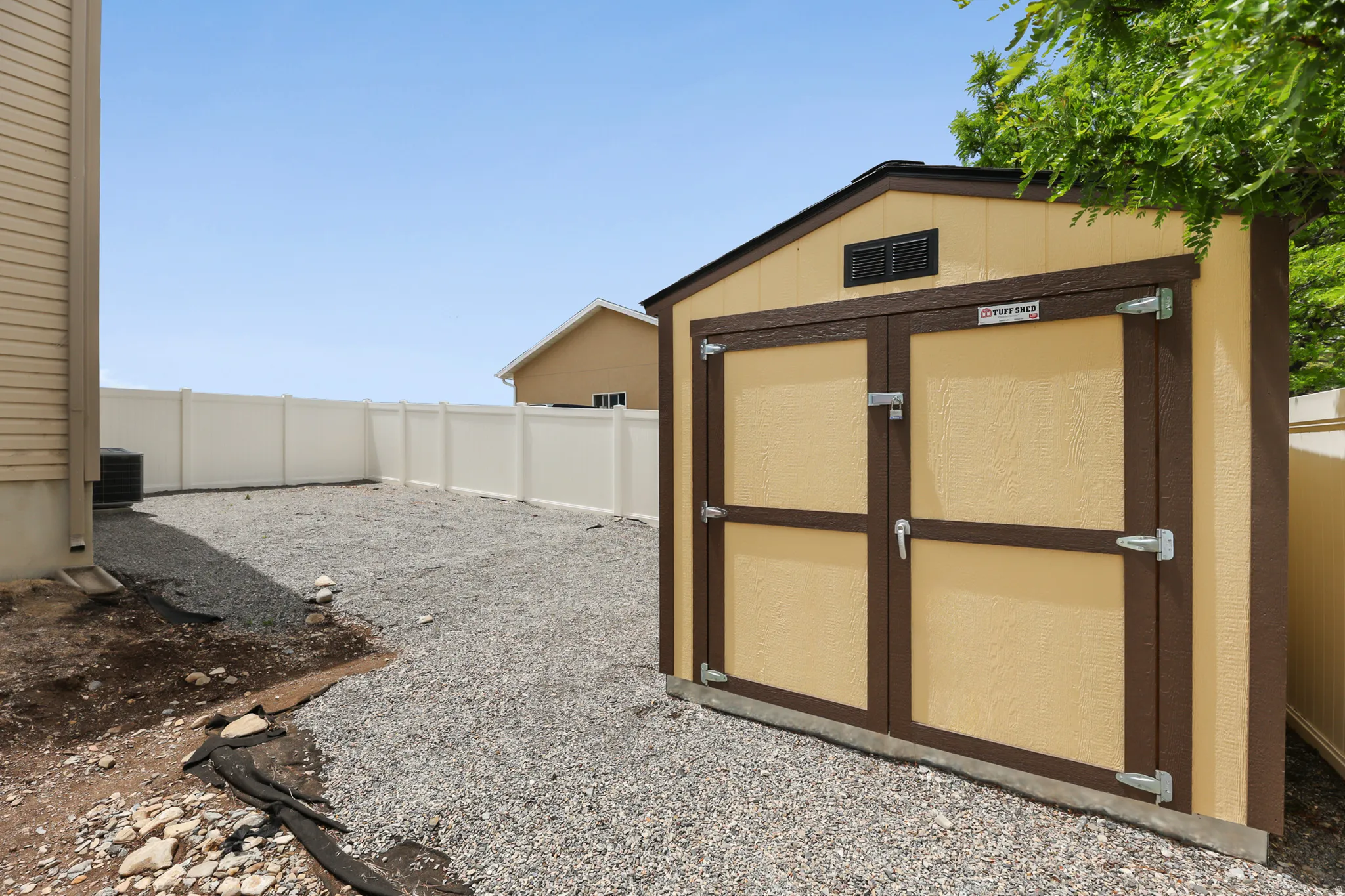 Freestanding storage shed featuring a dual-door entry, a gable roof, and an upper vent