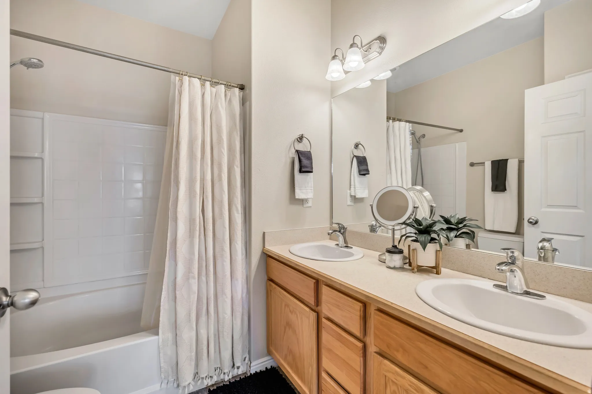 Main bedroom suite bathroom with dual vanity.
