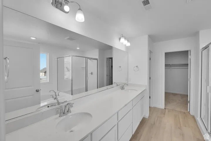 Double vanity with a white countertop and undermount sinks