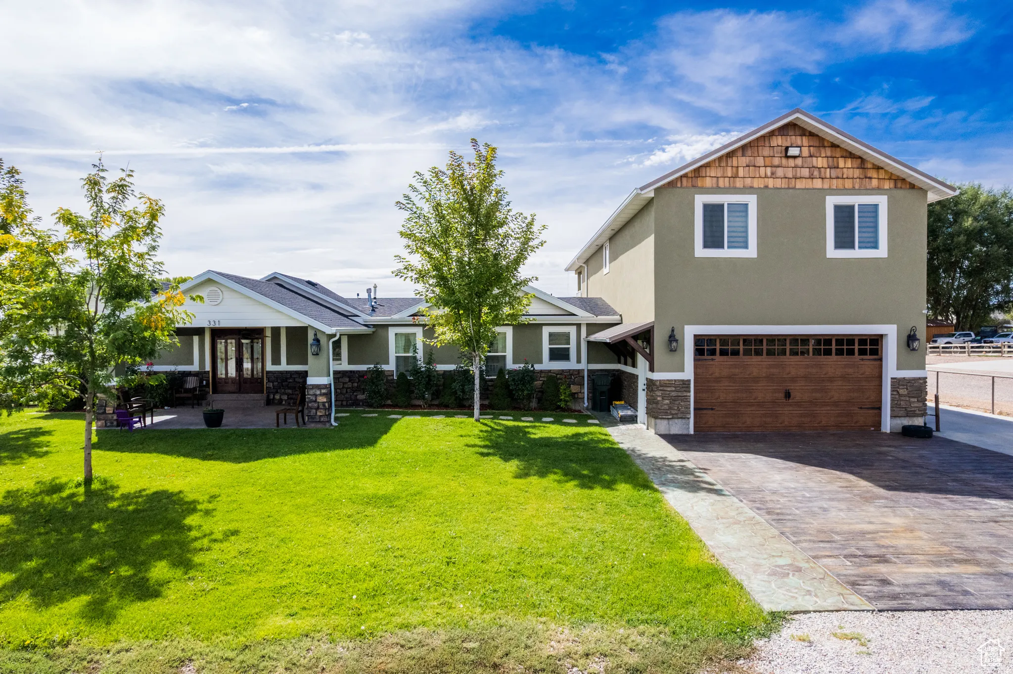 Contemporary exterior with stucco siding and stone accents