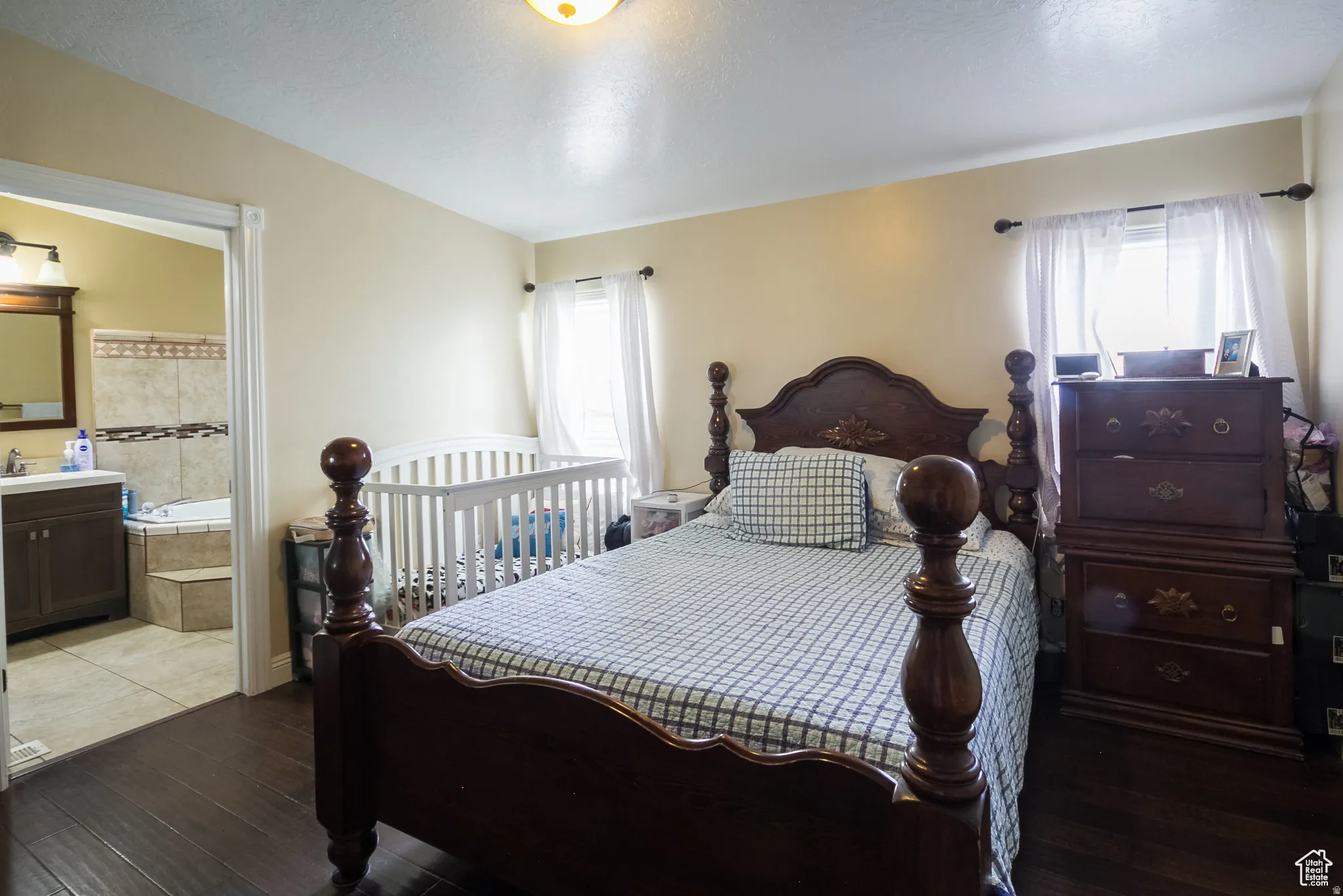 Bedroom with dark wood-finish flooring