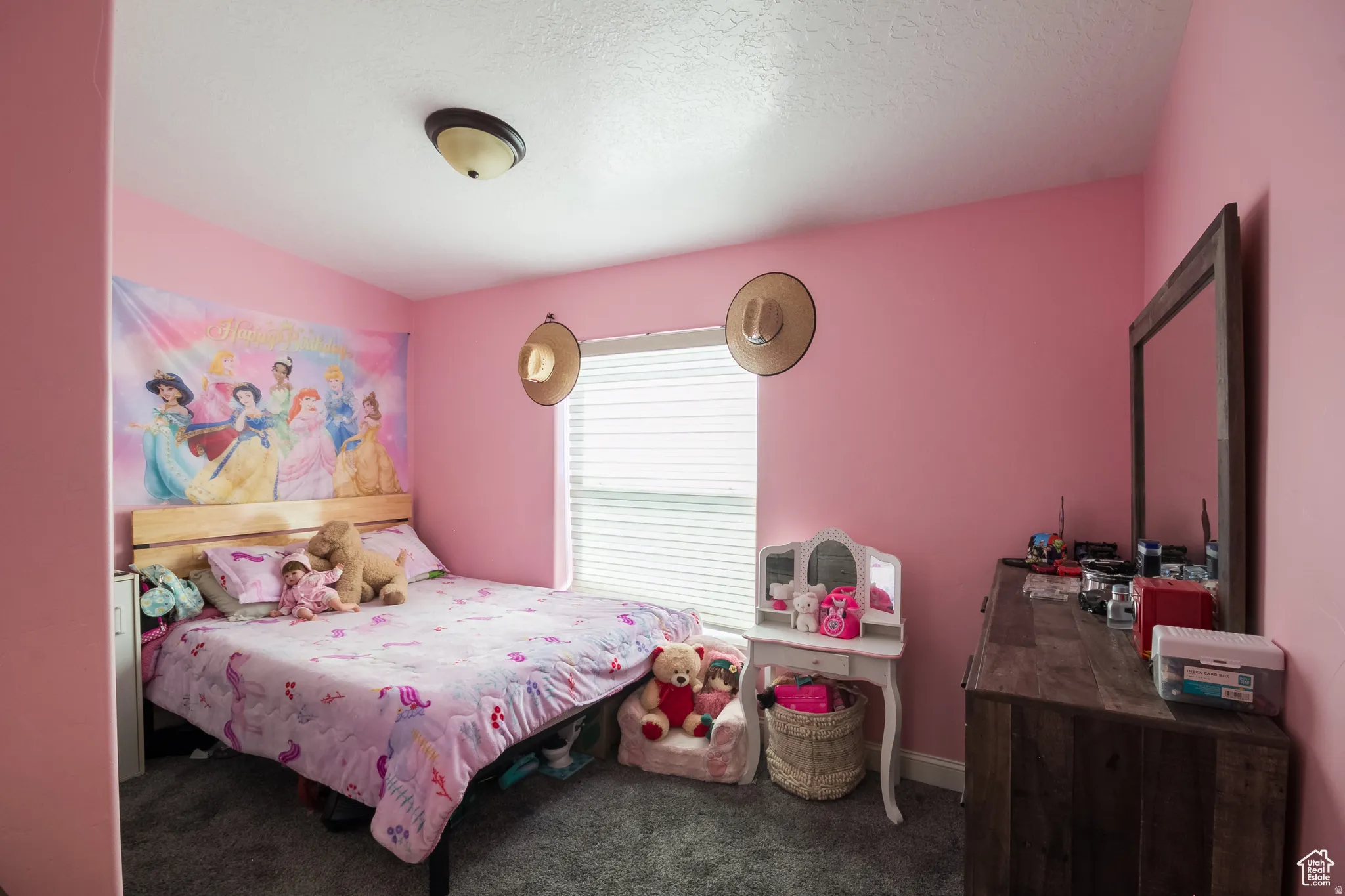 Room featuring wall-to-wall carpeting and a ceiling-mounted light fixture