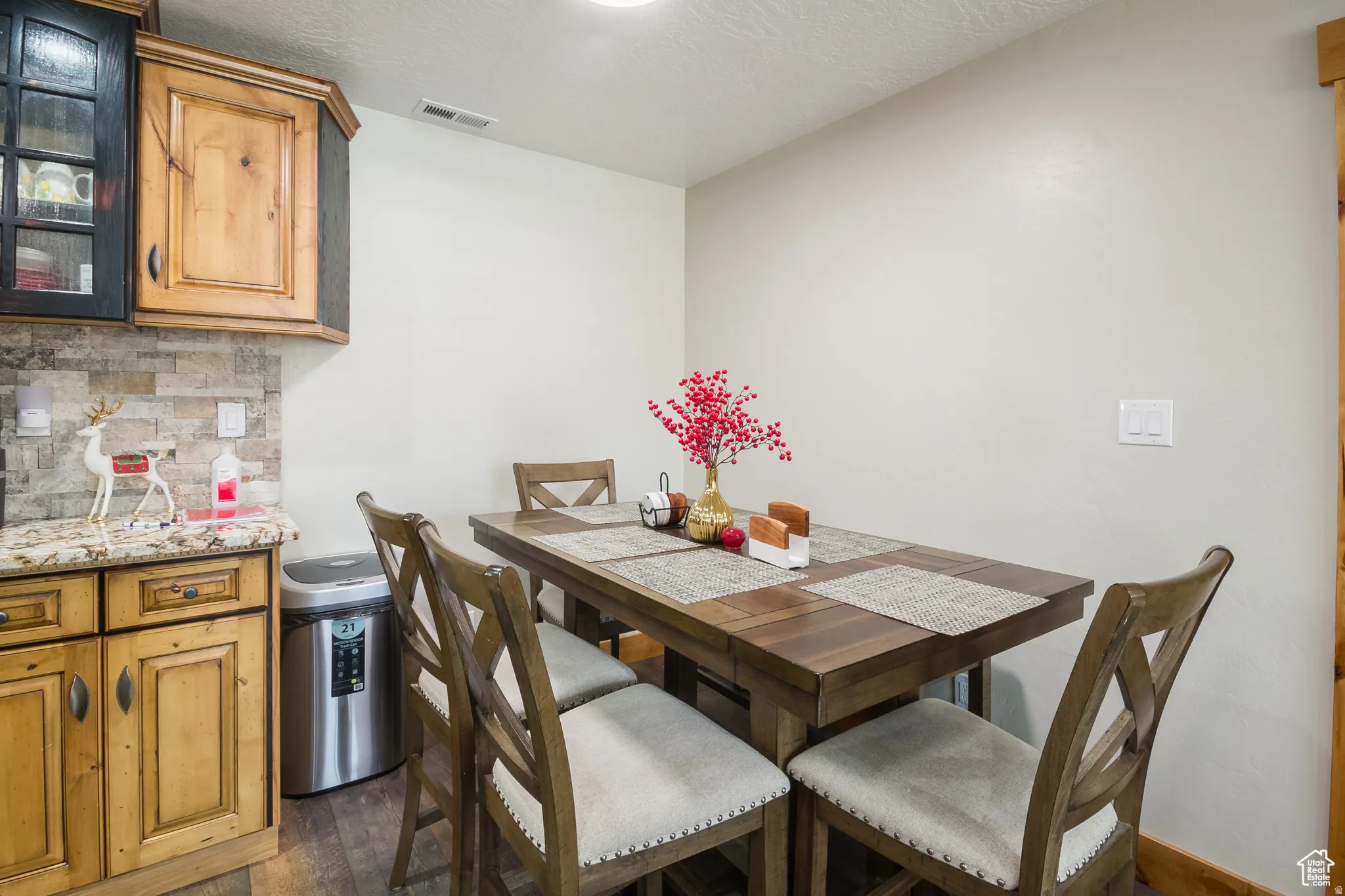 Dining area with wood-finish flooring