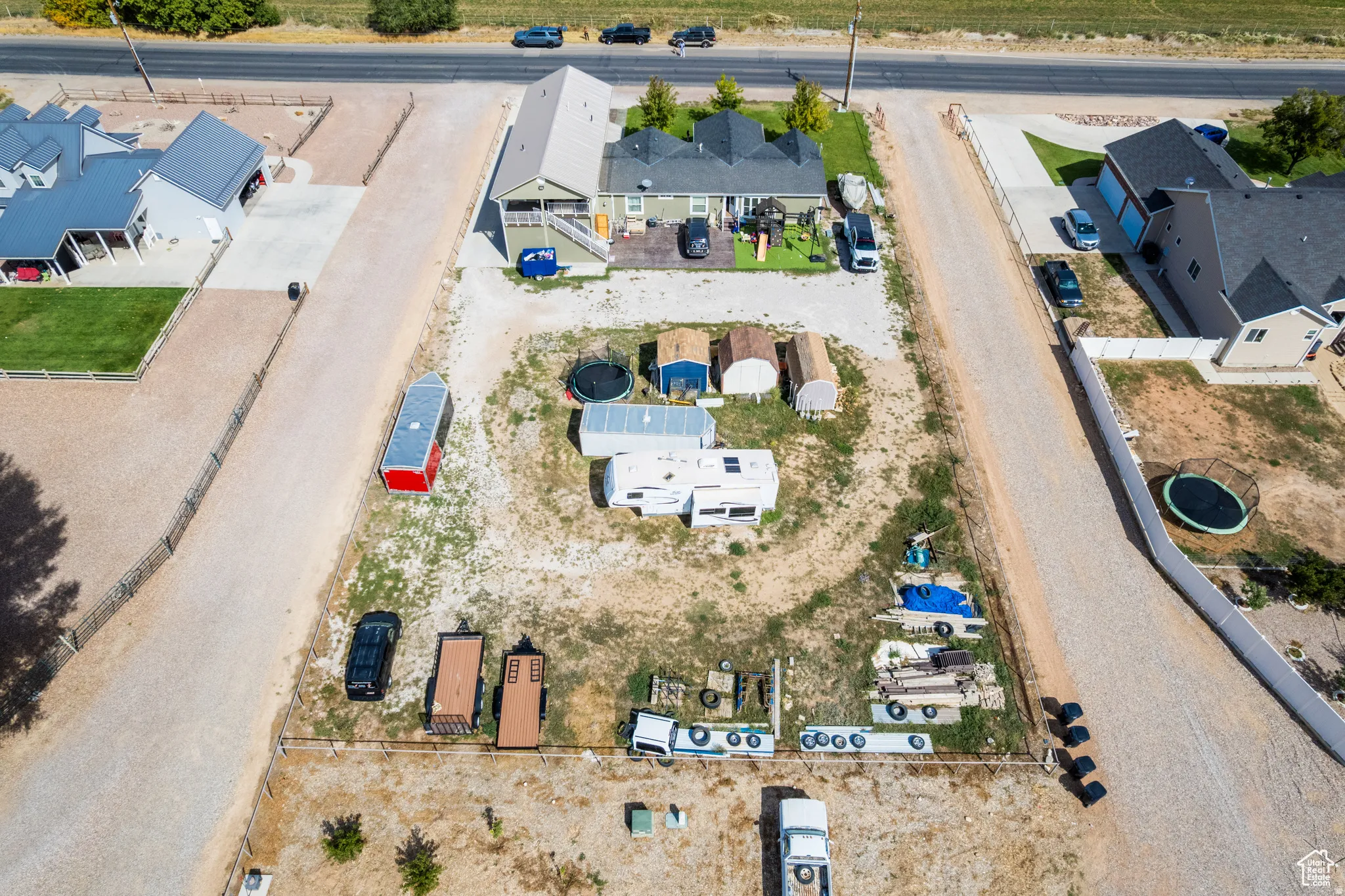 Aerial perspective showcasing a parcel of land with gravel access roads
