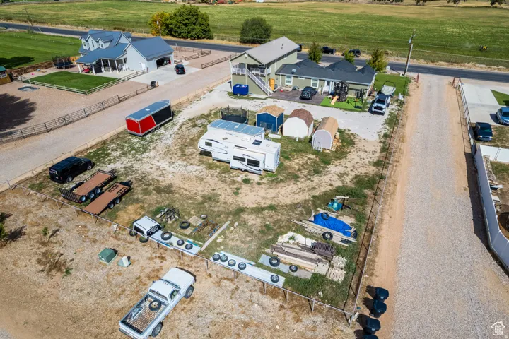 Gravel driveways providing access to multiple buildings and expansive open areas