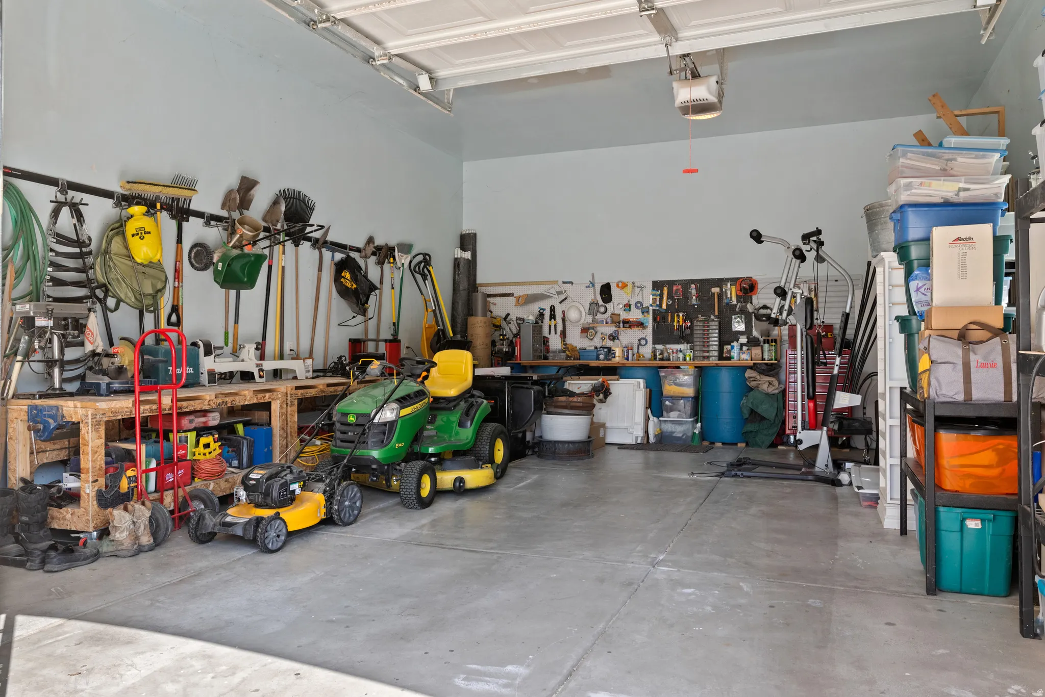 Spacious garage featuring concrete flooring and light-colored walls