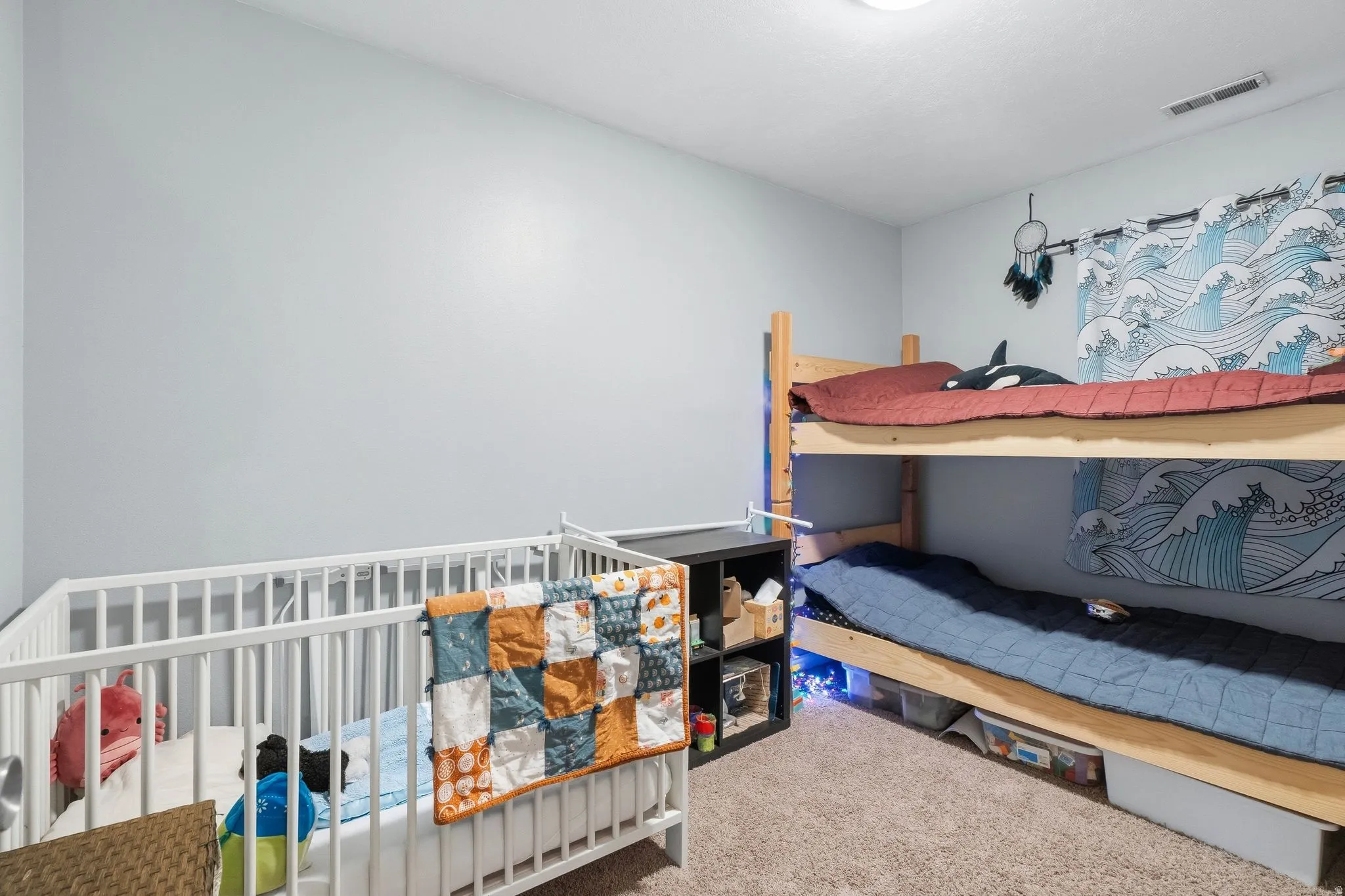 Carpeted room featuring light gray walls and a ceiling-mounted light fixture