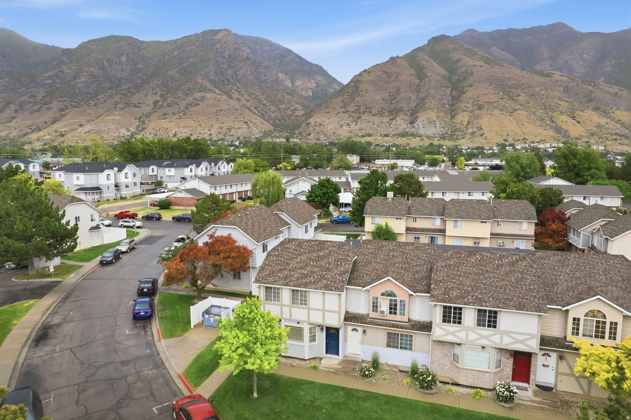 Residential community with prominent mountain backdrop featuring a variety of housing styles and established landscaping