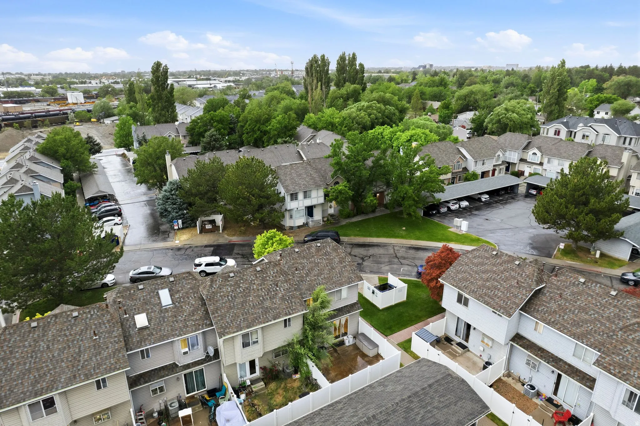 Aerial perspective showcasing a residential community with numerous two-story properties featuring shingle roofs