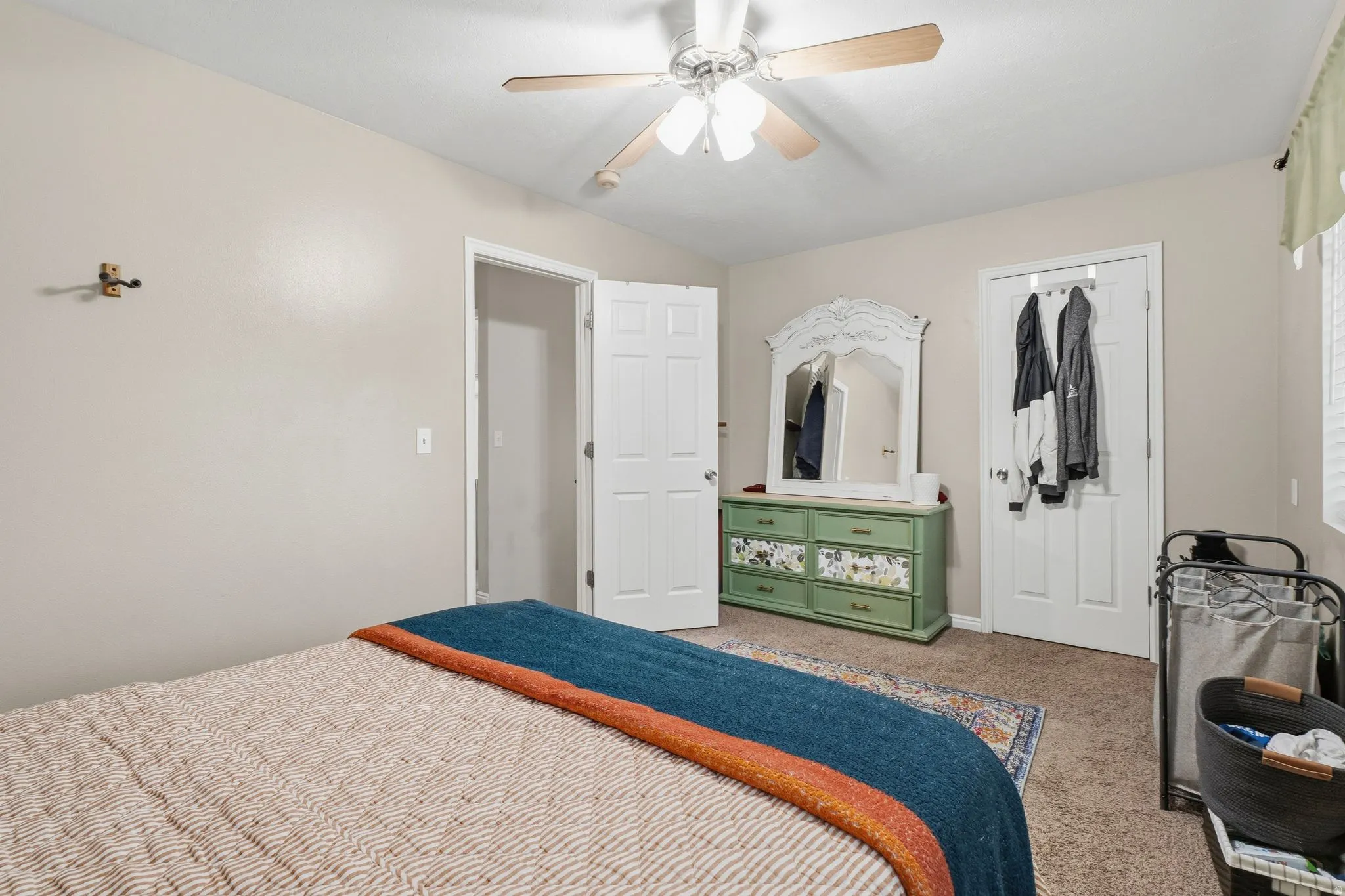 Neutral tone walls complement the textured carpeting