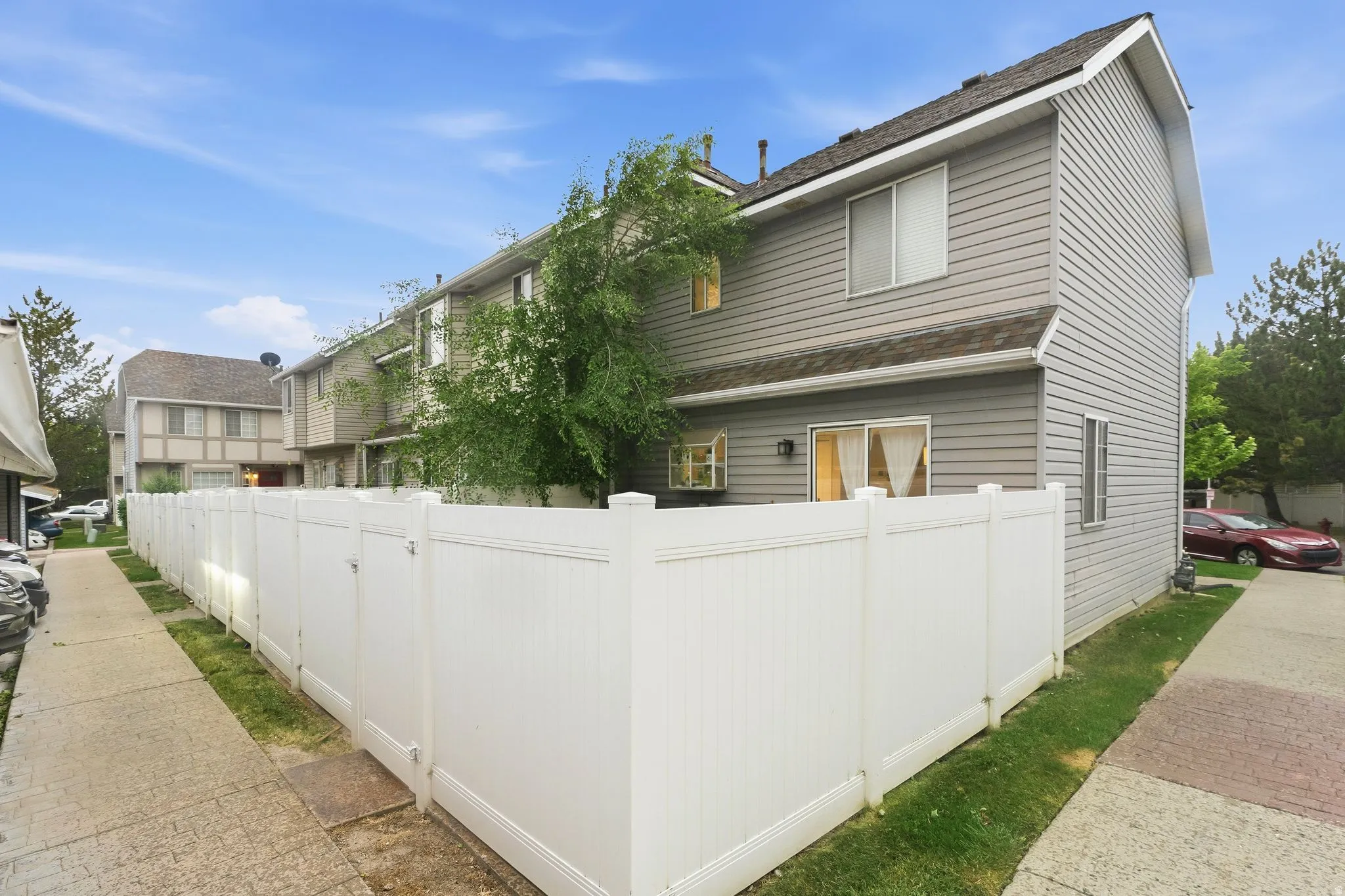 Exterior with gray horizontal siding and white trim