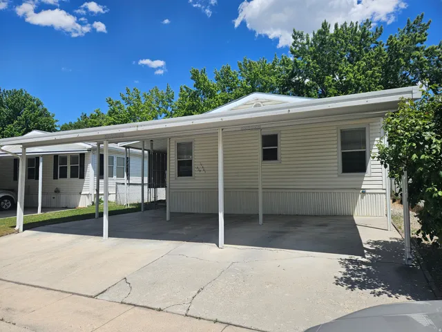 Spacious carport with concrete slab flooring