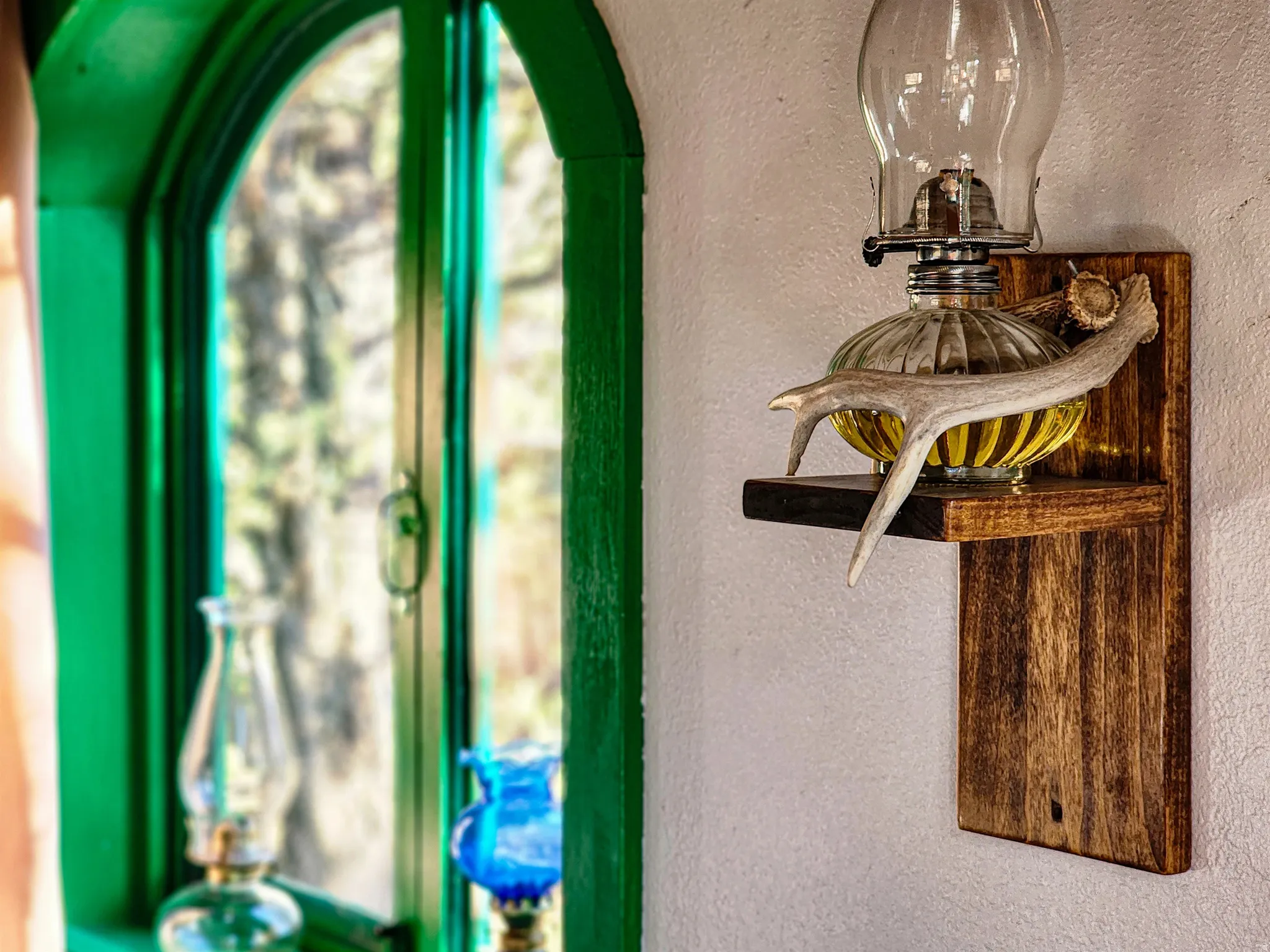 Arched window with vibrant green trim