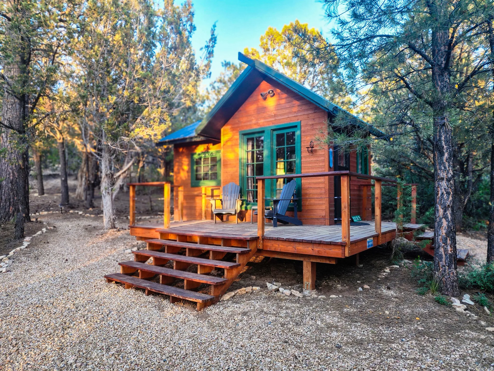 Wood-clad exterior with green trim accents and a pitched roof