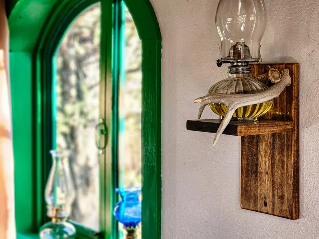 Arched window with vibrant green trim
