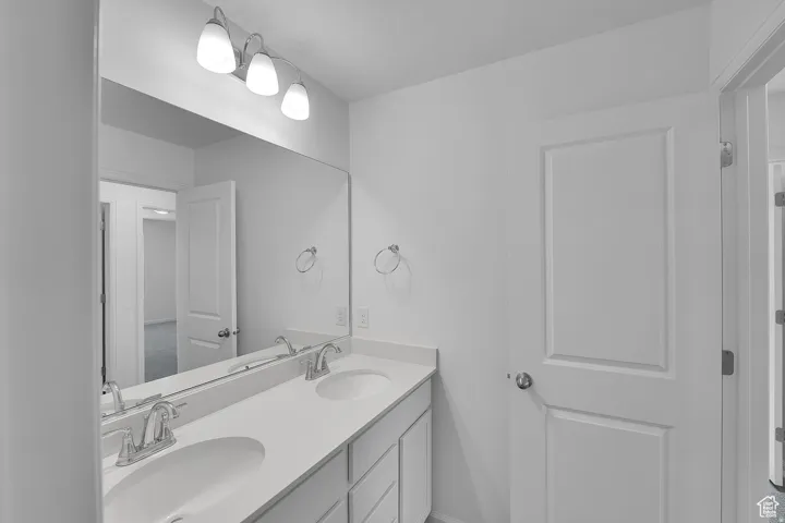 Double vanity with undermount sinks and chrome fixtures