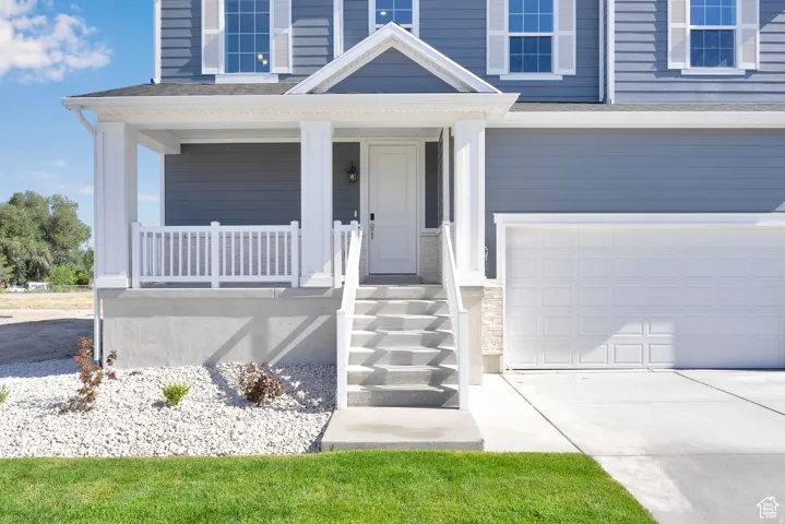 Two-story residence featuring blue siding and white trim