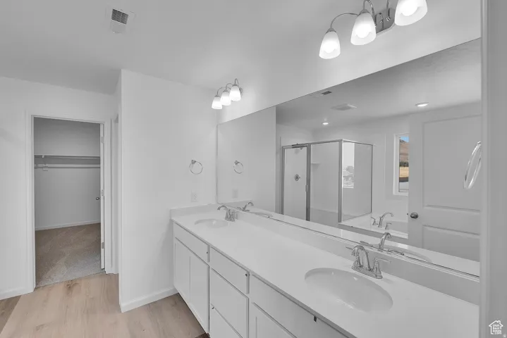 Dual vanity with integrated sinks and white cabinetry