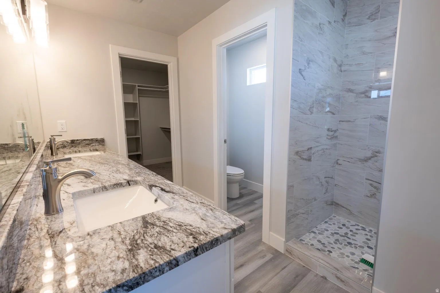 Dual vanity with stone countertop and undermount sinks