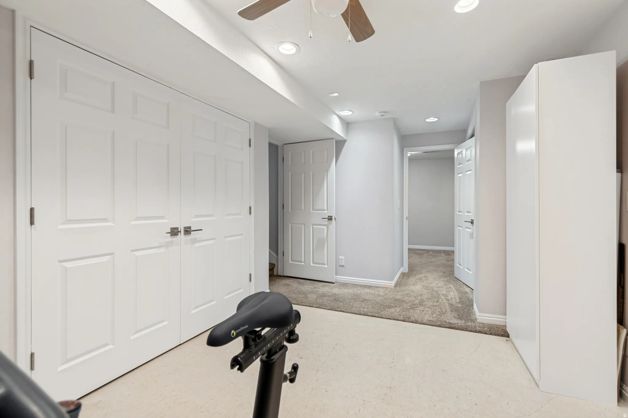 Room featuring light-toned carpeting and recessed lighting