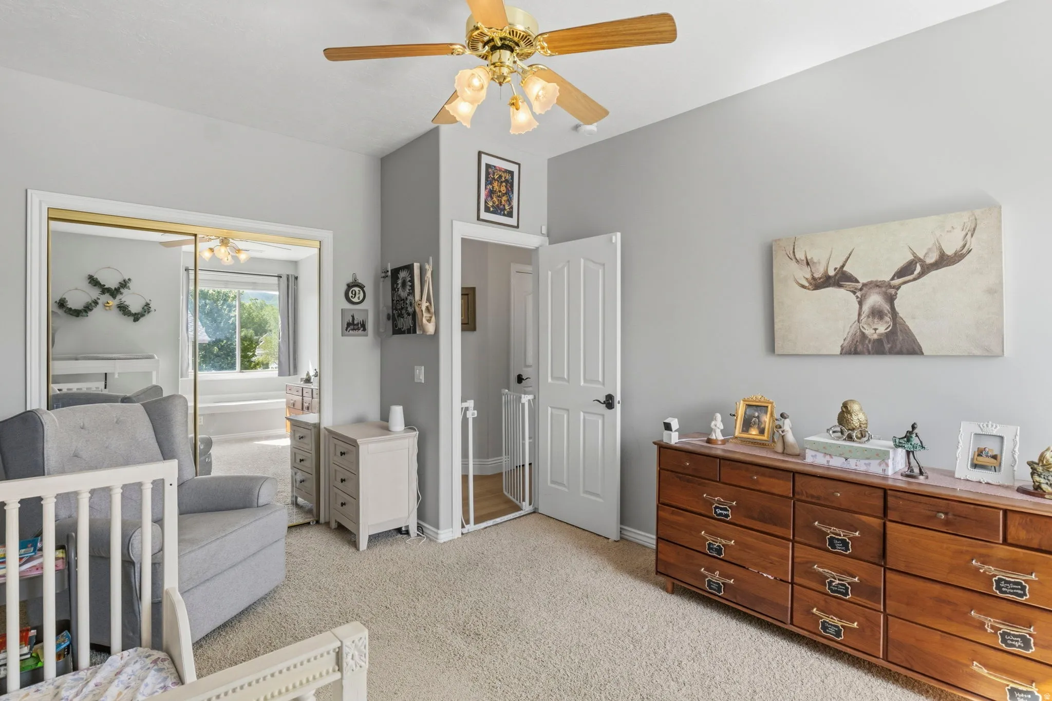 Recessed ceiling with an overhead fan, light gray wall paint, and plush carpeting