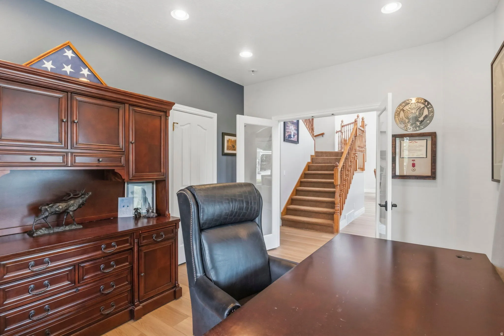 Dedicated space featuring wood-finish flooring, recessed lighting, and a neutral color palette