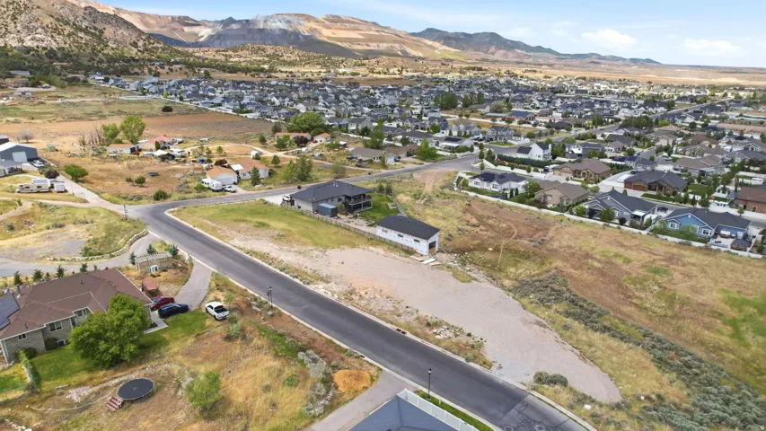 Expansive lot featuring road frontage and surrounding natural terrain