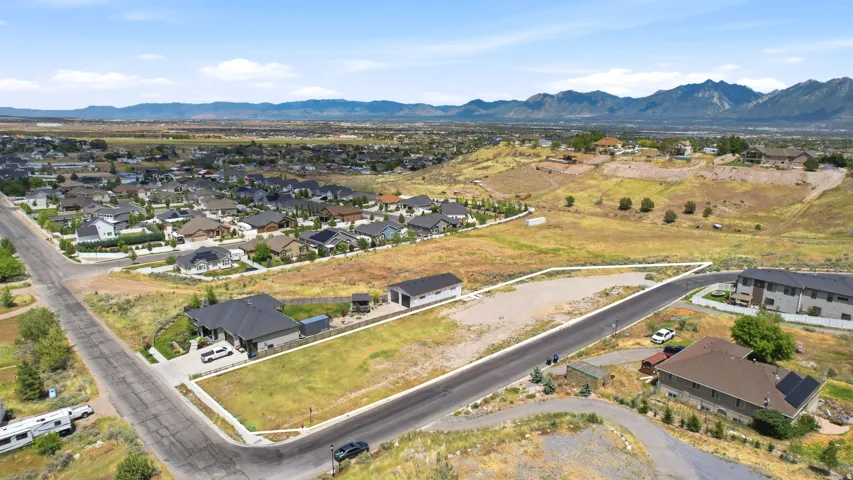 Expansive parcel featuring a defined boundary and paved road frontage