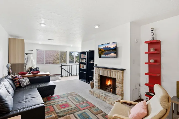 Brick-surround fireplace with a dark mantel