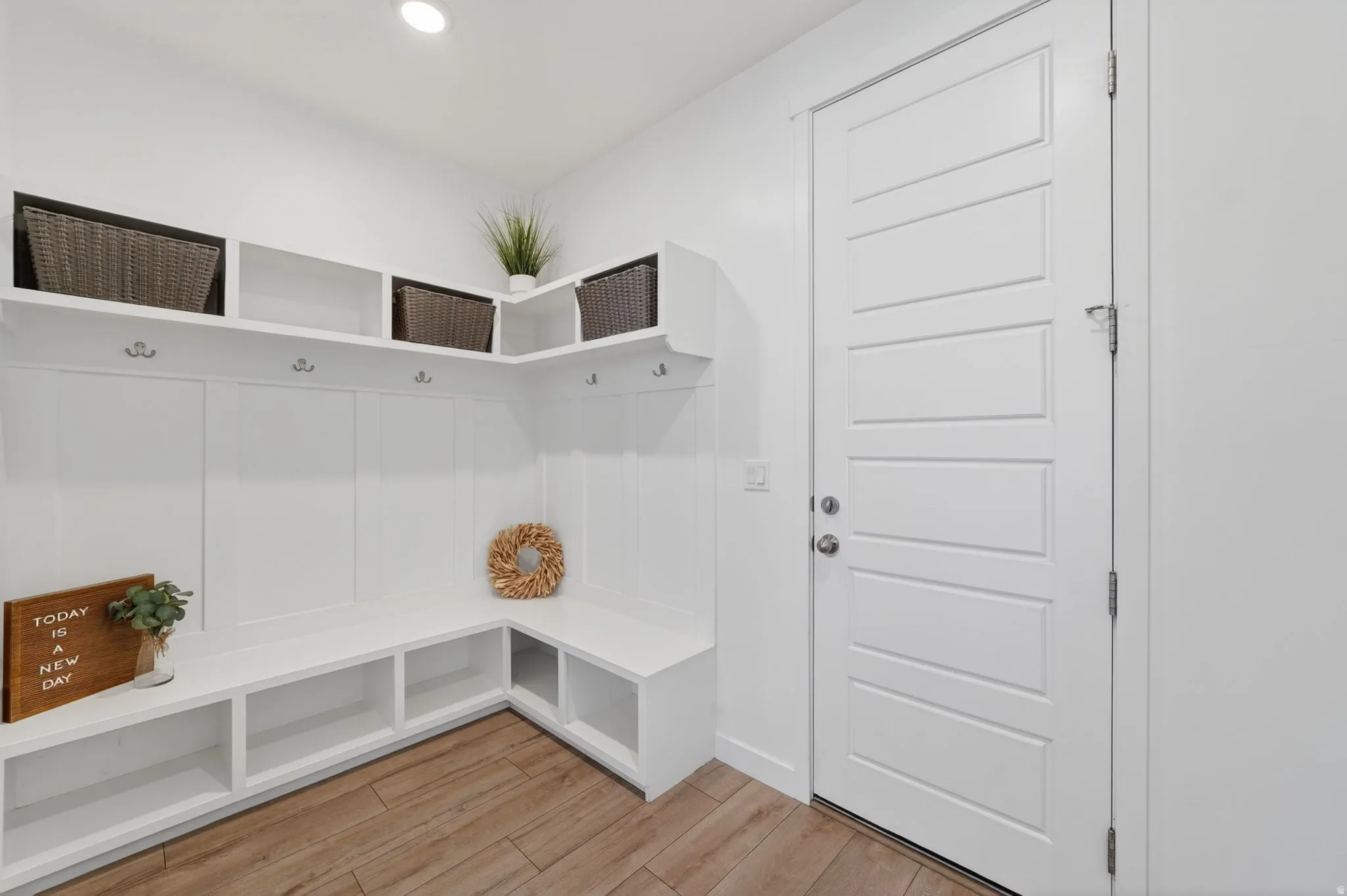 Built-in storage bench with multiple cubbies and hooks