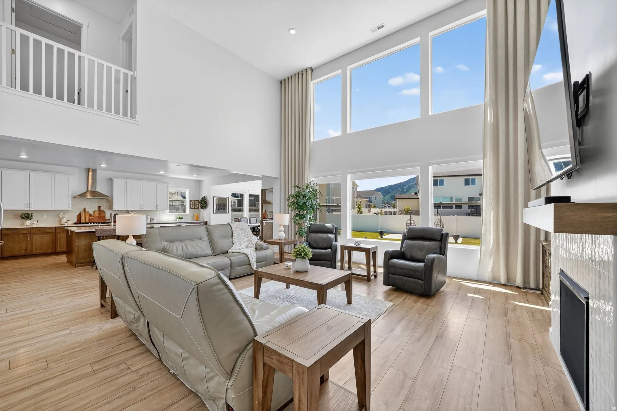 Two-story living area featuring a vaulted ceiling and an open-concept layout