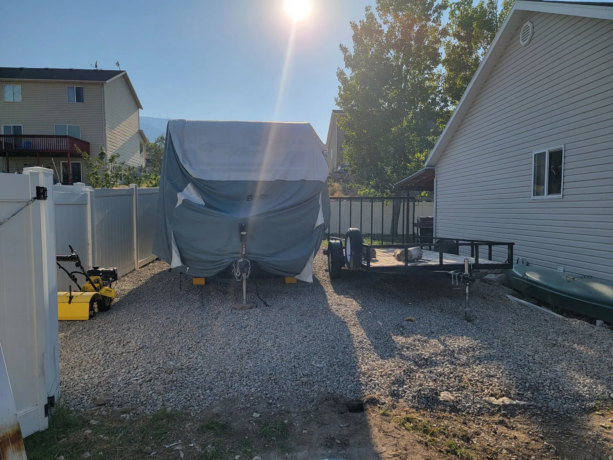 Gravel driveway offering ample parking