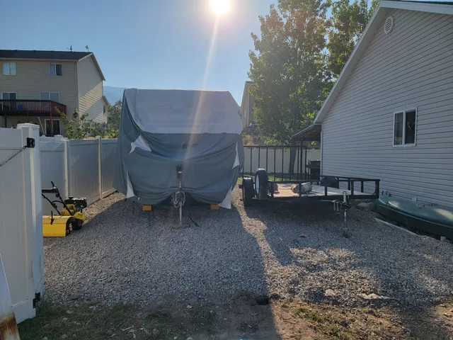 Gravel driveway offering ample parking