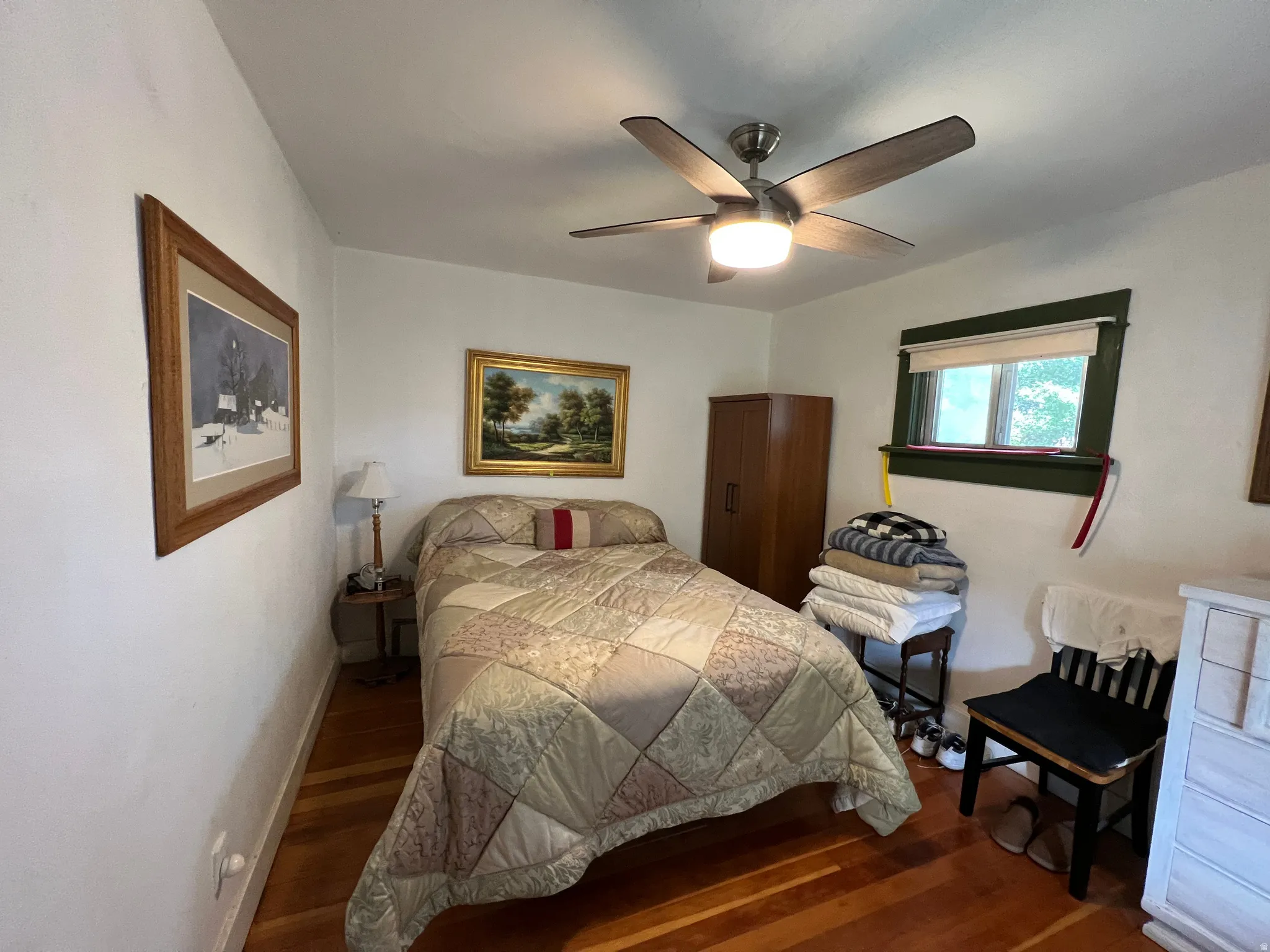 Warm wood-finish flooring complements the neutral wall tones