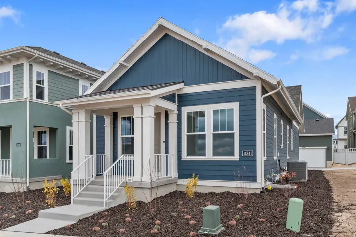 Exterior featuring blue siding and white trim accents