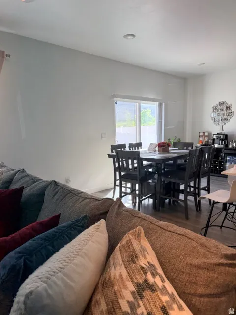 Dining area with wood-finish flooring and a sliding glass door