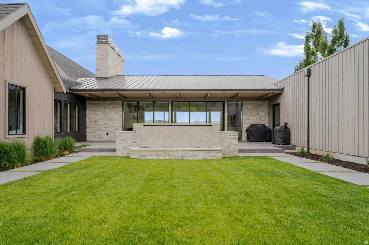 Manicured lawn with concrete paver pathways