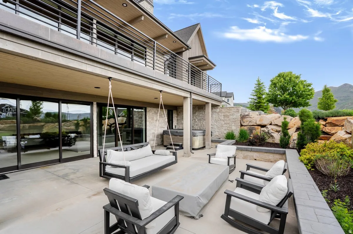 Spacious outdoor patio with direct access via multiple sliding glass doors