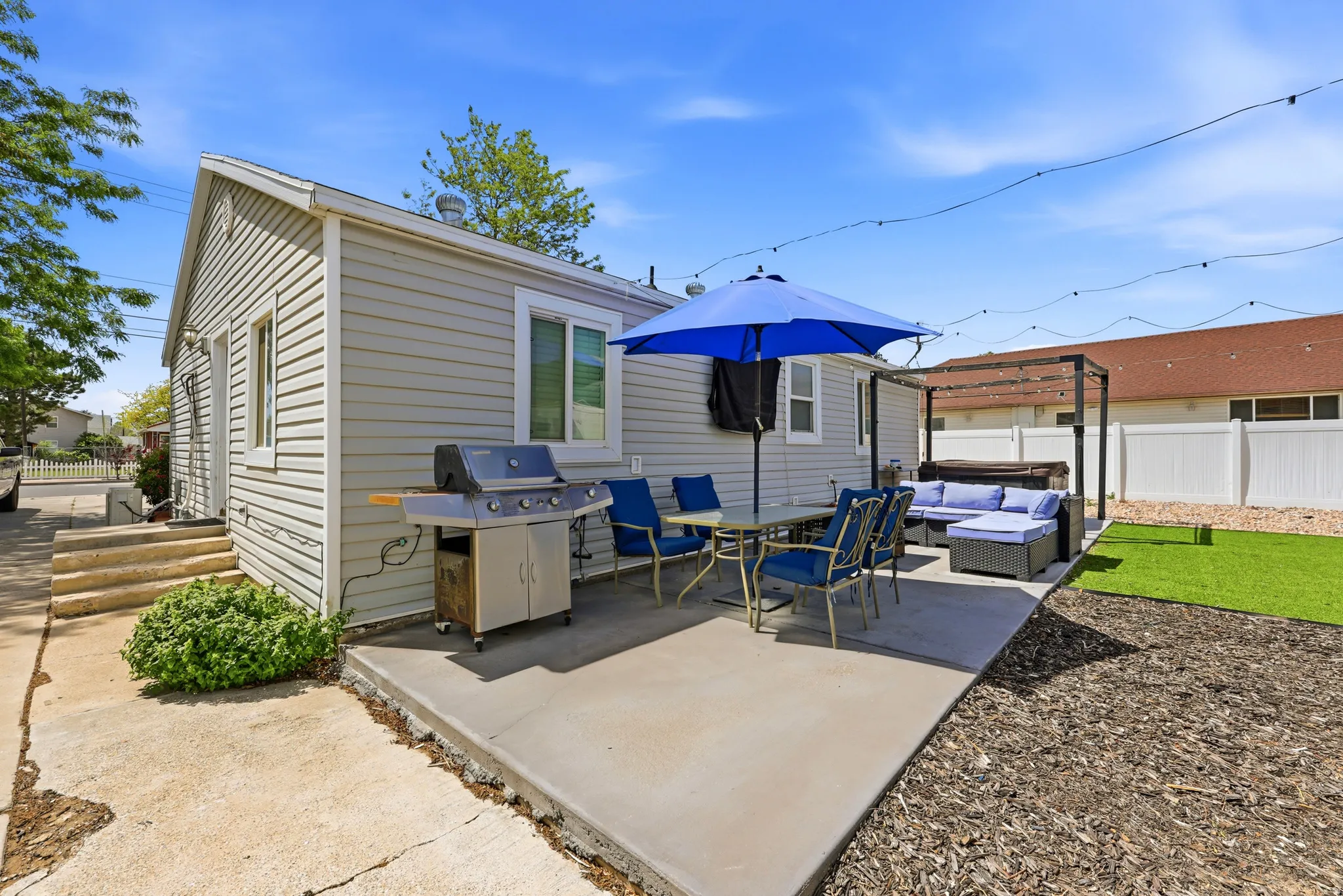 Rear exterior featuring horizontal siding and a concrete patio