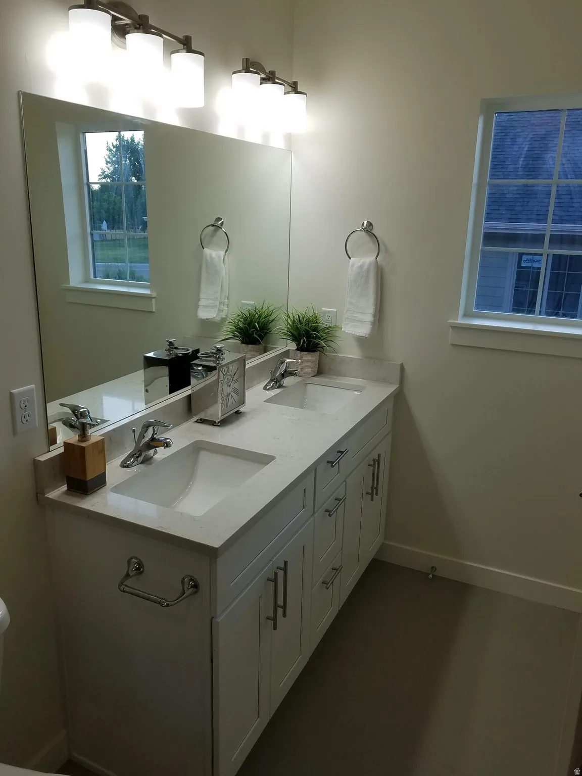 Dual vanity with integrated sinks and a light-toned countertop