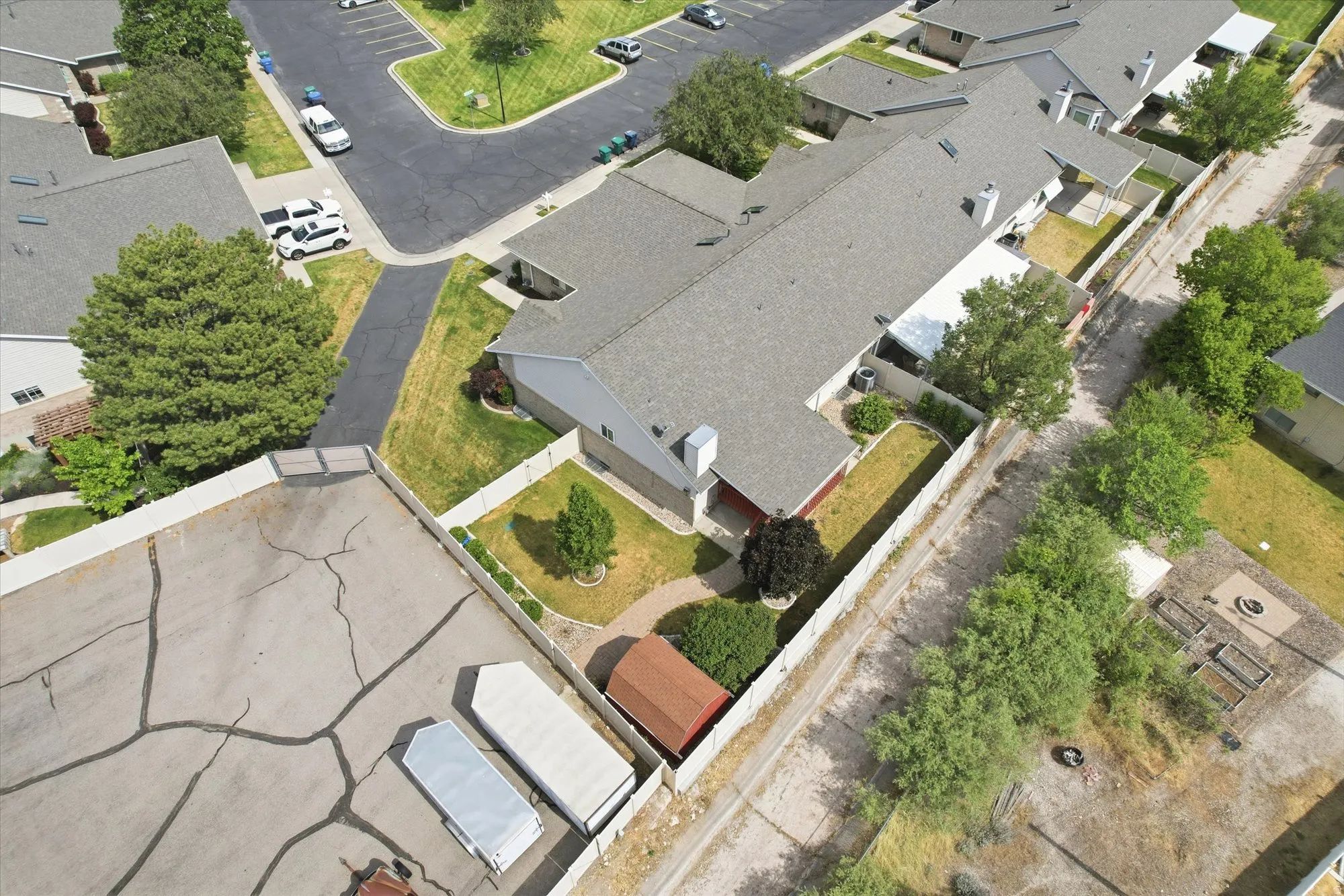 Aerial perspective showcasing a multi-unit property with a gabled roofline