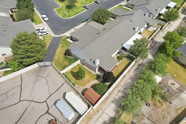 Aerial perspective showcasing a multi-unit property with a gabled roofline