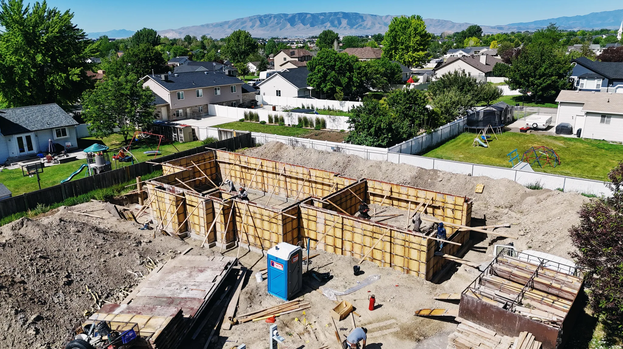 Foundation forms installed on a level lot, ready for concrete