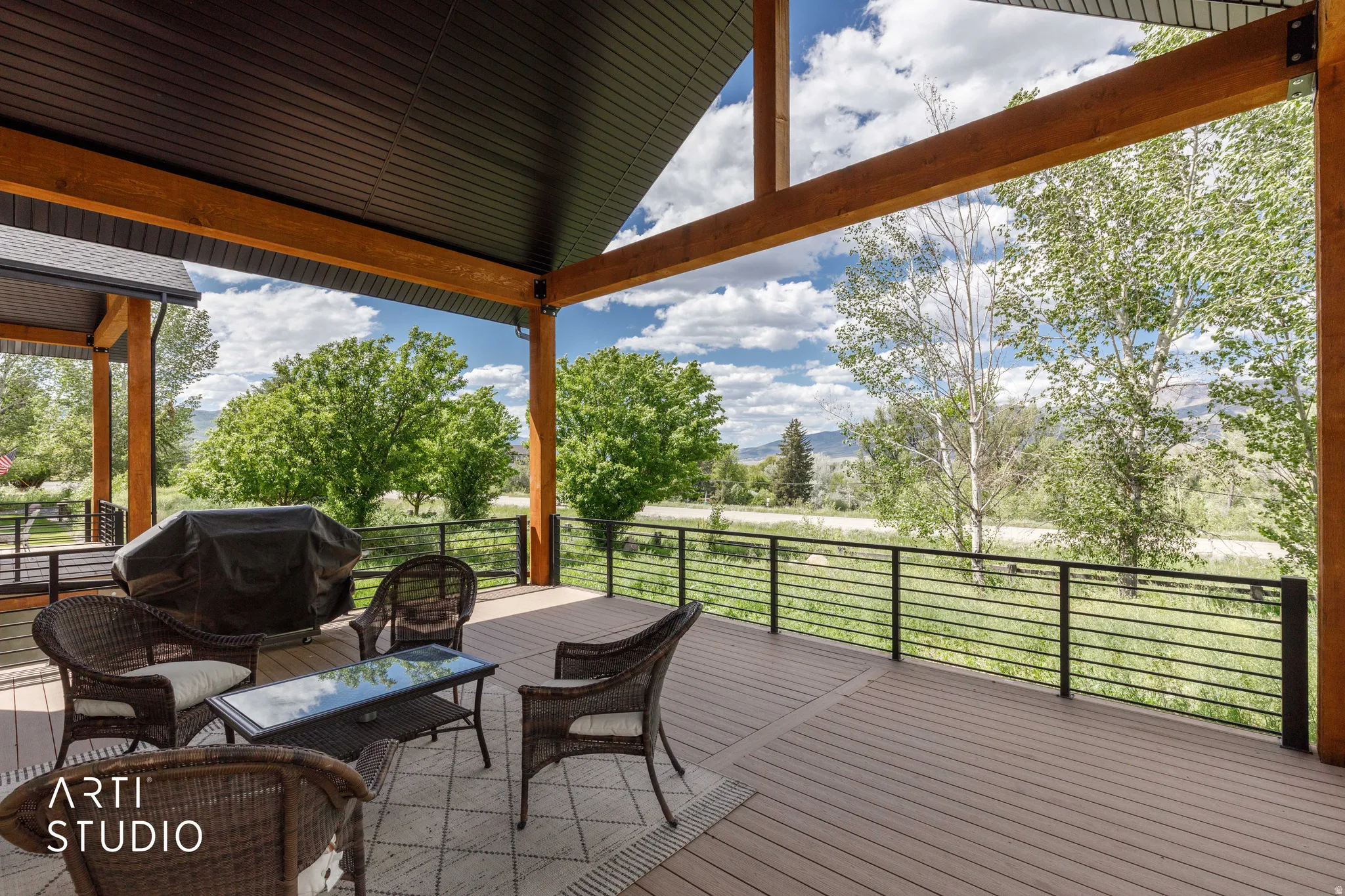 Expansive covered deck featuring wood-finish composite decking