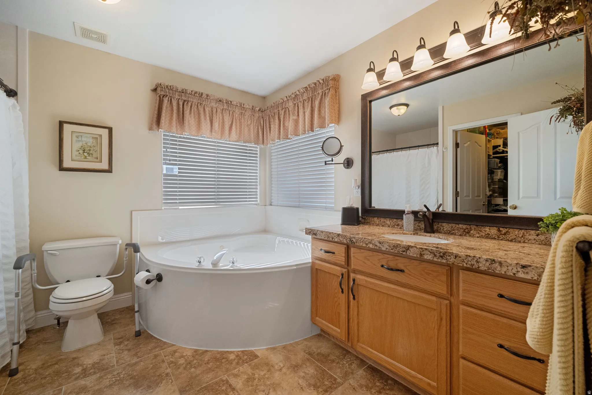 Primary bath with jetted tub and large,  walk-in shower.